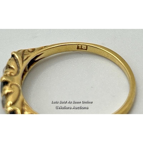 304 - A sapphire and diamond five stone carved style band in yellow metal stamped 18 and tested as 18ct go... 