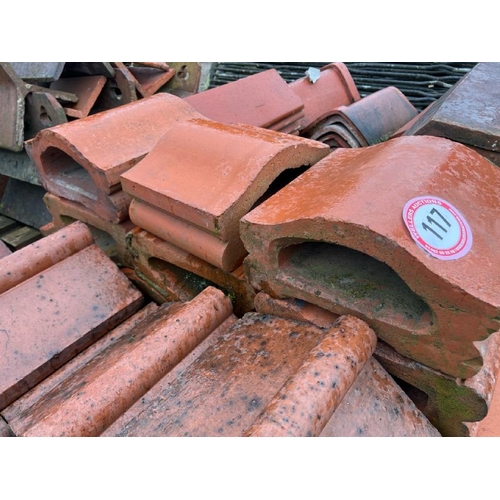 117 - A large quantity of assorted terracotta roll top ridge tiles and terracotta coping, sizes and styles... 