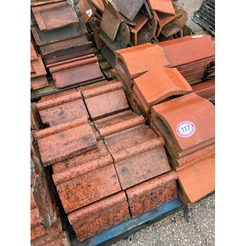 117 - A large quantity of assorted terracotta roll top ridge tiles and terracotta coping, sizes and styles... 