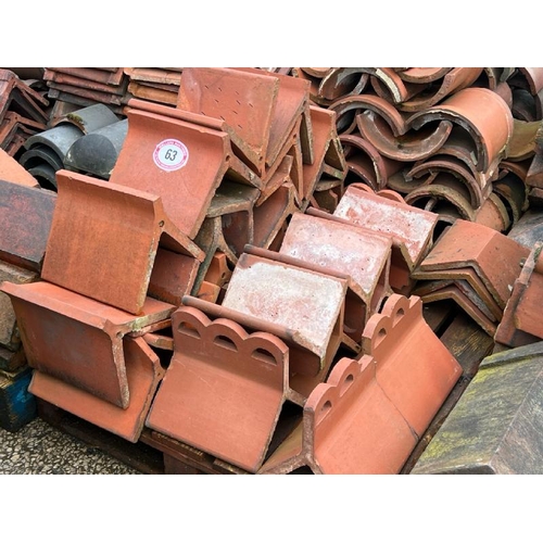 63 - Pallet of assorted decorative red ridge roof tiles, sizes and styles vary