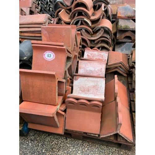 63 - Pallet of assorted decorative red ridge roof tiles, sizes and styles vary