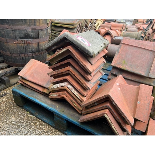 66 - Pallet of approx. x40 assorted ridge roof tiles. Sizes and angles vary.