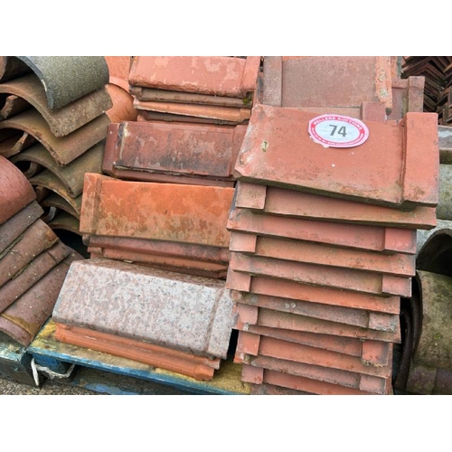 74 - Pallet of approx. x80 assorted red ridge roof tiles, sizes and angles vary