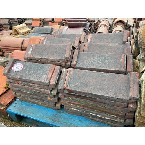 86 - Pallet of approx. x60 red ridge roof tiles, each measures approx. 46cm l