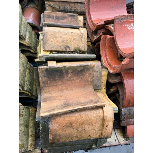 94 - Pallet of approx. x50 assorted ridge and half round roof tiles, yellow and terracotta, sizes and sty... 