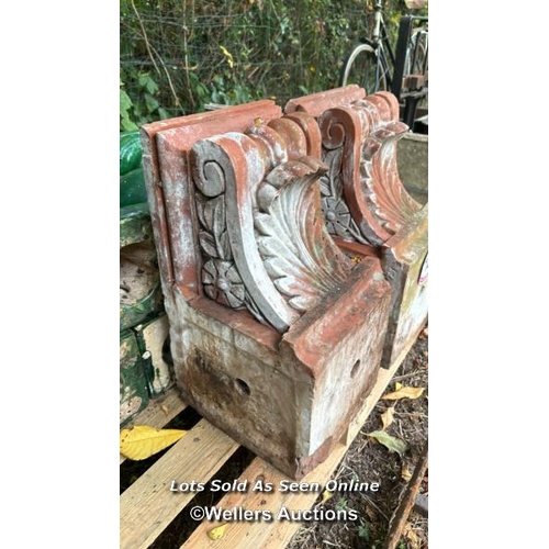 128 - Pair of terracotta corbels, 26cm (h) x 24cm (w) x 45cm (d) / Please bring equipment and labour to as... 