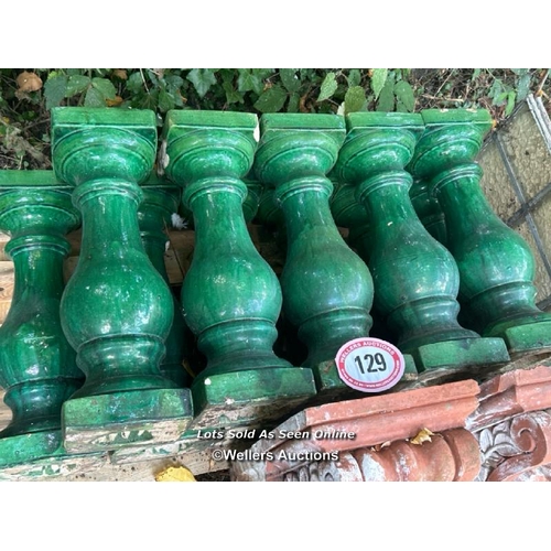 129 - Twelve glazed balustrade spindles, 49cm (h) / Please bring equipment and labour to assist with remov... 