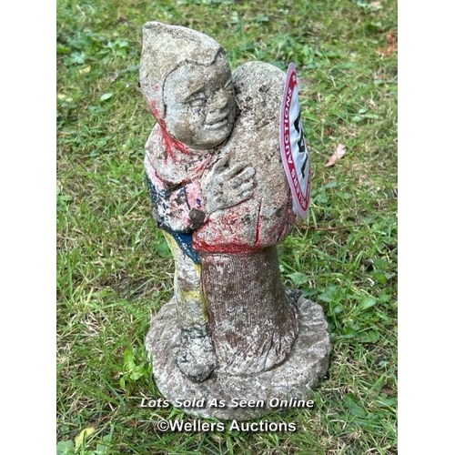 141 - Gnome embracing a mushroom, 30cm (h) / Please bring equipment and labour to assist with removal of a... 