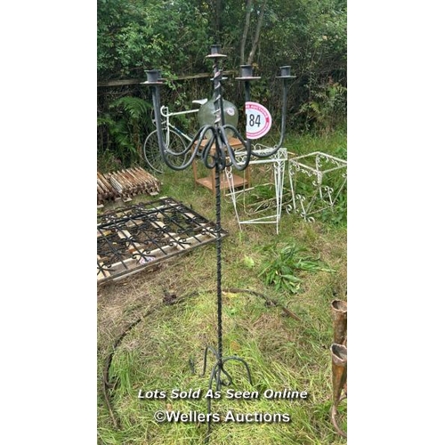 184 - Six arm wrought iron candle holder stand, 146cm (h) / Please bring equipment and labour to assist wi... 