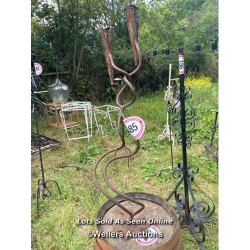 185 - Two arm wrought iron candle holder stand, 82cm (h) / Please bring equipment and labour to assist wit... 