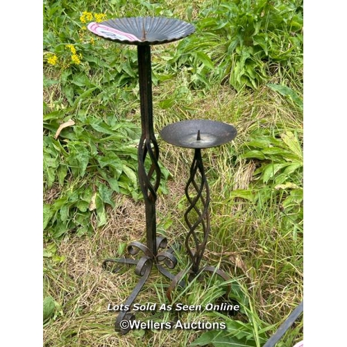 190 - Two single candle stick holding stands, largest 64cm (h) / Please bring equipment and labour to assi... 