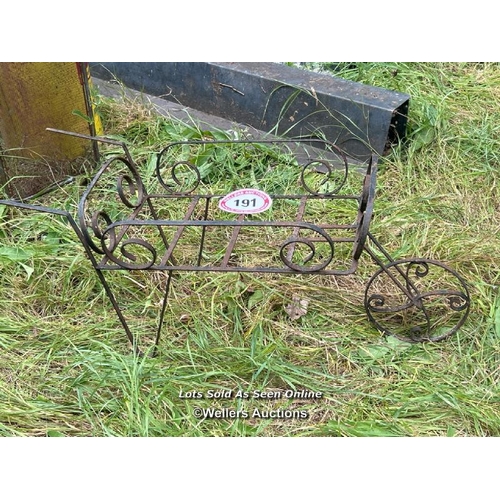 191 - Wrought iron wheel barrow, 85cm long / Please bring equipment and labour to assist with removal of a... 