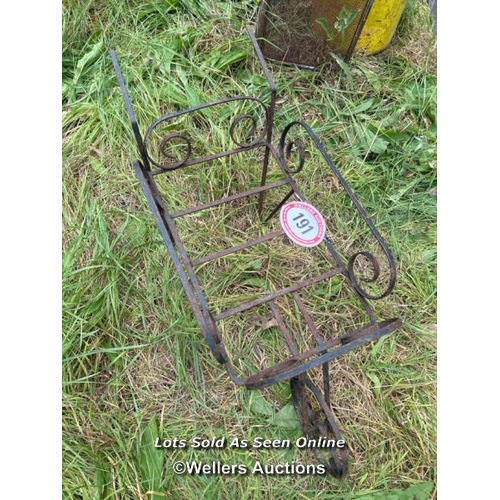 191 - Wrought iron wheel barrow, 85cm long / Please bring equipment and labour to assist with removal of a... 