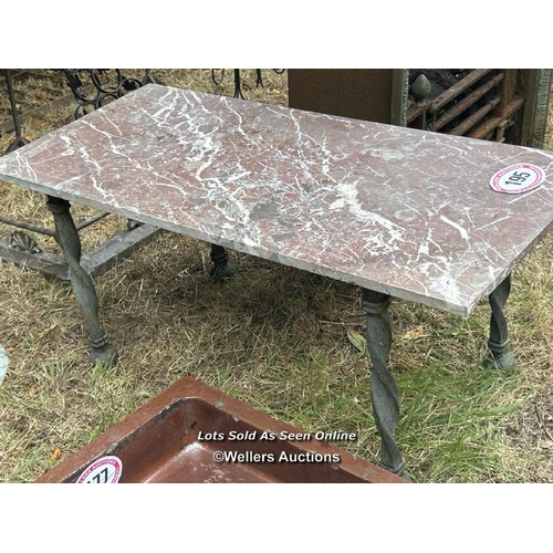 195 - Rouge marble table top on heavy wrought iron base, 48cm (h) x 48cm (w) x 108cm (l) / Please bring eq... 