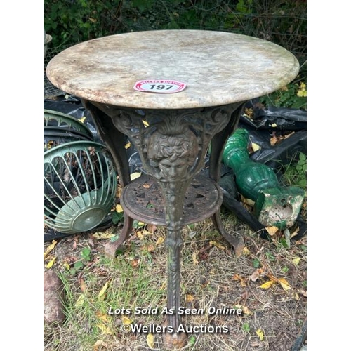 197 - Victorian marble topped pub table top on ornate cast iron base, 69cm (h) x 60cm (dia) / Please bring... 