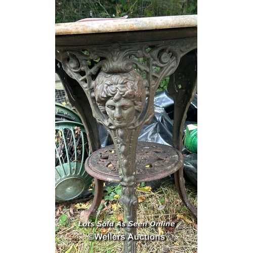 197 - Victorian marble topped pub table top on ornate cast iron base, 69cm (h) x 60cm (dia) / Please bring... 