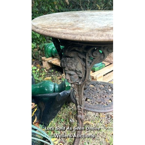 197 - Victorian marble topped pub table top on ornate cast iron base, 69cm (h) x 60cm (dia) / Please bring... 