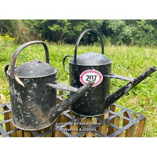 207 - Two painted galvanised watering cans / Please bring equipment and labour to assist with removal of a... 