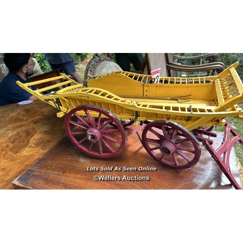 222 - A miniature model horsedrawn hay wagon, 24cm (h) x 75cm (l) / Please bring equipment and labour to a... 