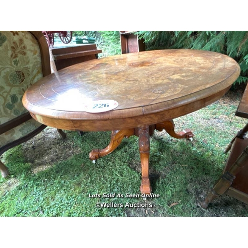 226 - A Victorian walnut loo table with quartered veneered top, marquetry inlay on carved quadra base, 72c... 