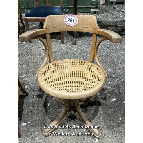 261 - A bentwood revolving chair with cane seat, 82cm (h) x 62cm (w) x 47cm (d) / Please bring equipment a... 