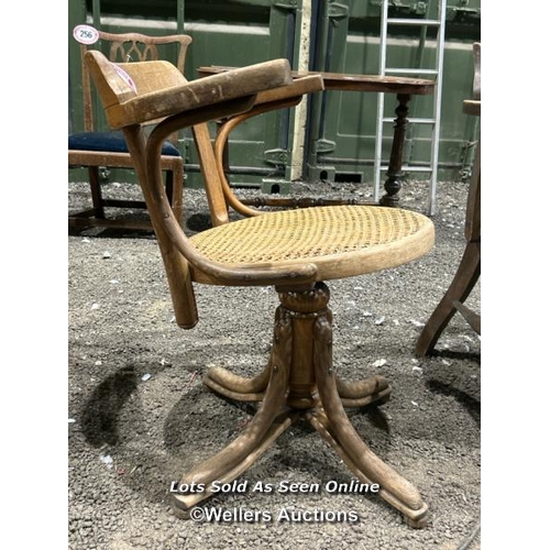 261 - A bentwood revolving chair with cane seat, 82cm (h) x 62cm (w) x 47cm (d) / Please bring equipment a... 