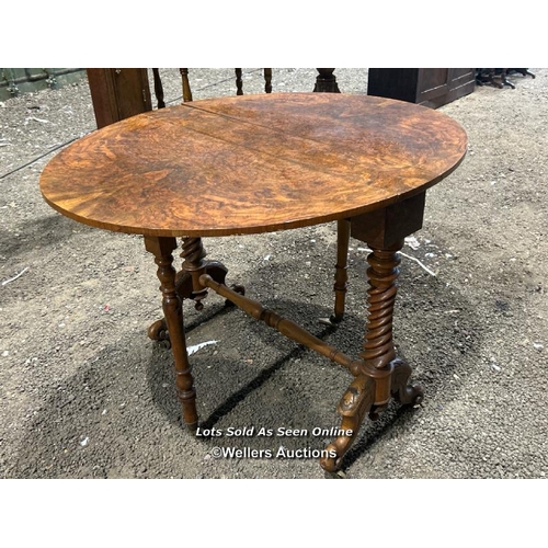 265 - A c.1850's bur walnut Sutherland table of supurb quality, on carved barley twist legs and original c... 