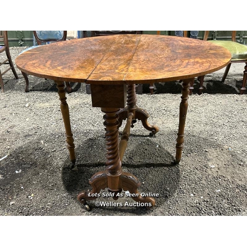 265 - A c.1850's bur walnut Sutherland table of supurb quality, on carved barley twist legs and original c... 