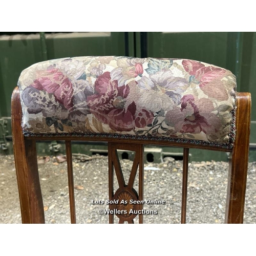 285 - A Victorian mahogany Sheraton revival nursing chair with upholstered floralette seat and head rest, ... 