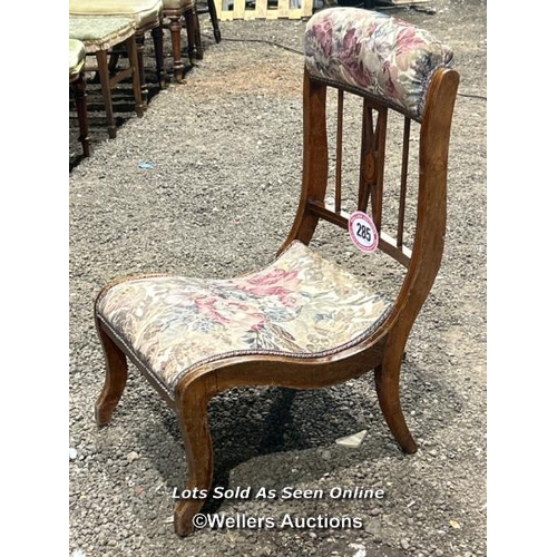 285 - A Victorian mahogany Sheraton revival nursing chair with upholstered floralette seat and head rest, ... 