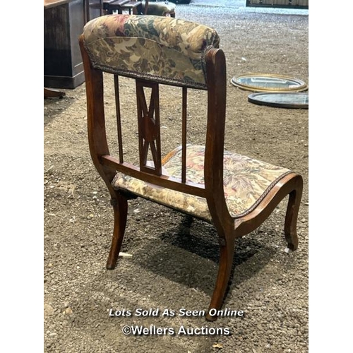 285 - A Victorian mahogany Sheraton revival nursing chair with upholstered floralette seat and head rest, ... 