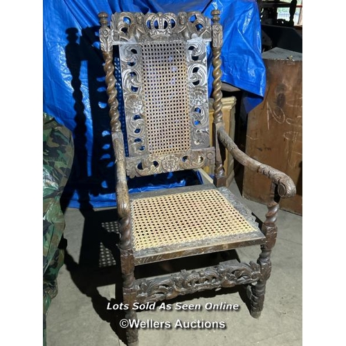 298 - A Carolean style carver chair, possibly walnut, profusely carved with barley twist sides, crowns and... 