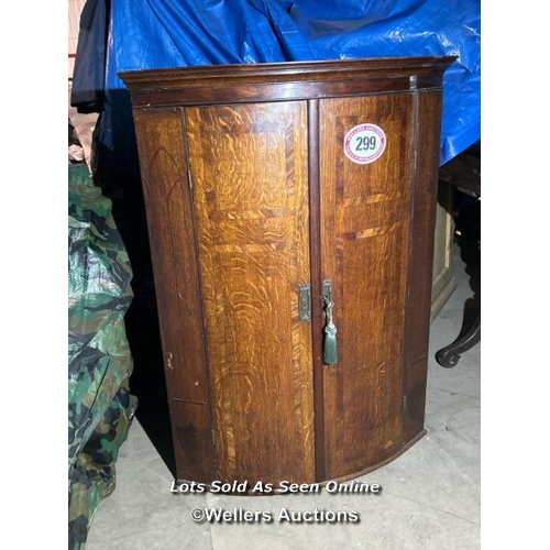 299 - A Sheraton period oak bowfront corner cupboard with mahogany cross banding and ebonised inlay, 103cm... 