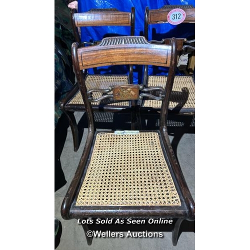 312 - Three regency style cane chairs on sabre legs, included are the original upholstered seat pads, 84cm... 