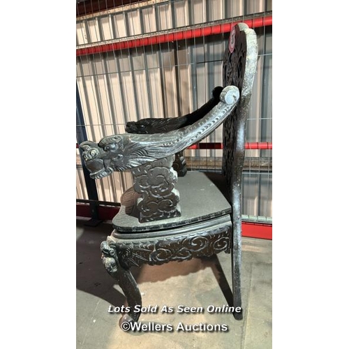 317 - A heavily carved oriental chair, 102cm (h) x 56cm (w) x 43cm (d) / Please bring equipment and labour... 