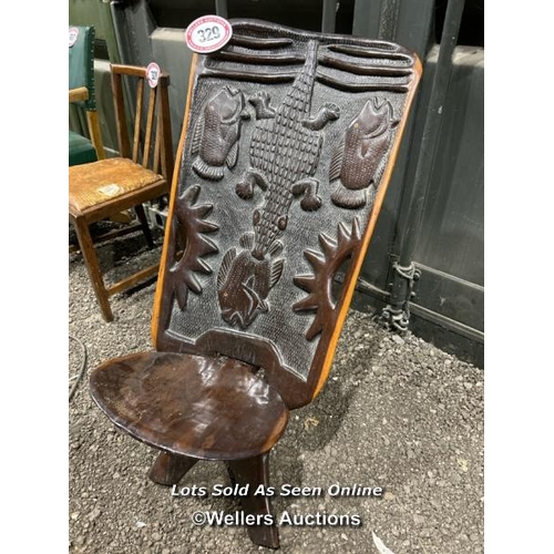 329 - A profusely carved African animalia hardwood birthing chair, 94cm (h) x 51cm (w) x 39cm (d) / Please... 