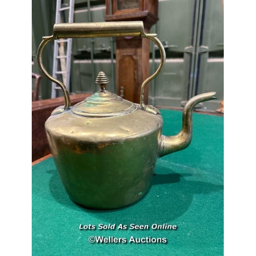 341 - A Georgian brass kettle, 28cm (h) x 30cm (l) / Please bring equipment and labour to assist with remo... 