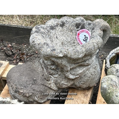 38 - Reconstituted stone boot statue, 28cm (h) / Please bring equipment and labour to assist with removal... 