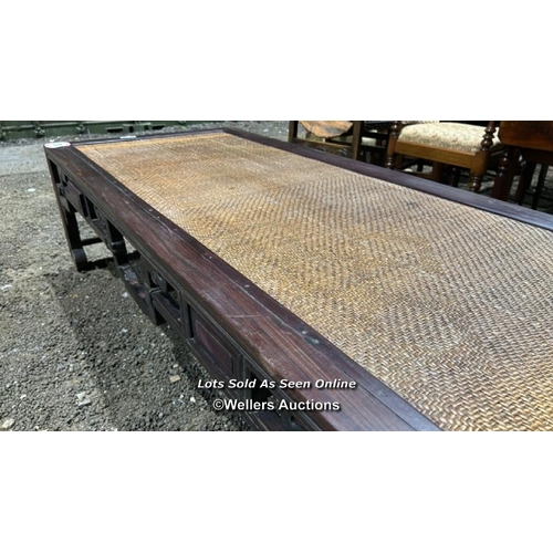 387 - A Chinese rosewood day bed with cane top, 49cm (h) x 180cm (w) x 78cm (w) / Please bring equipment a... 