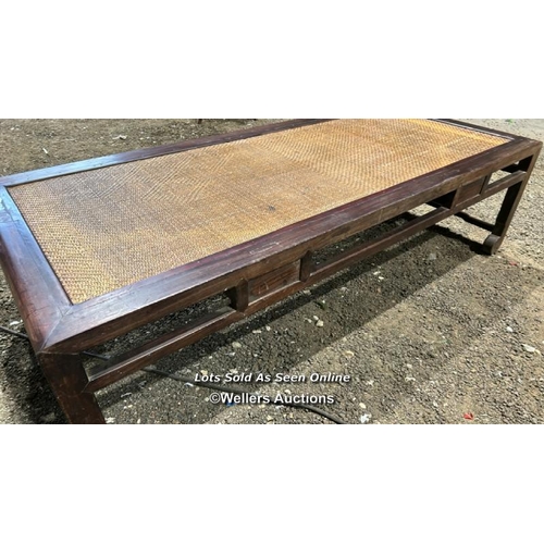 387 - A Chinese rosewood day bed with cane top, 49cm (h) x 180cm (w) x 78cm (w) / Please bring equipment a... 