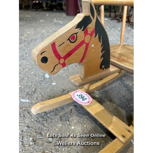 394 - A small wooden rocking horse, 44cm (h) x 82cm (l) x 31cm (w) / Please bring equipment and labour to ... 