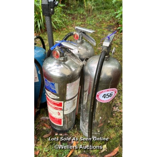 456 - Three steel fire extinguishers / Please bring equipment and labour to assist with removal of all lot... 