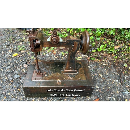 531 - A vintage sewing machine on wooden base / Please bring equipment and labour to assist with removal o... 