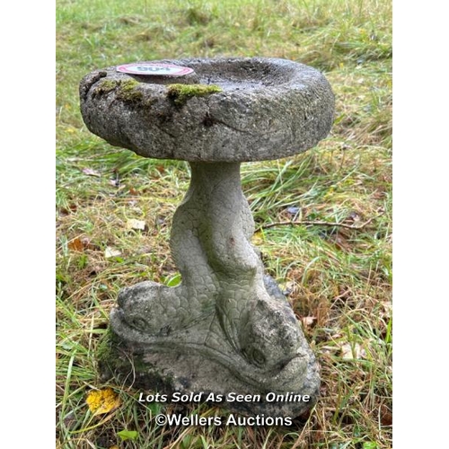 543 - A two piece concrete stone birdbath on dolphin base, 51cm (h) / Please bring equipment and labour to... 