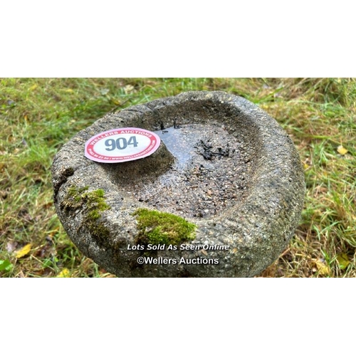 543 - A two piece concrete stone birdbath on dolphin base, 51cm (h) / Please bring equipment and labour to... 