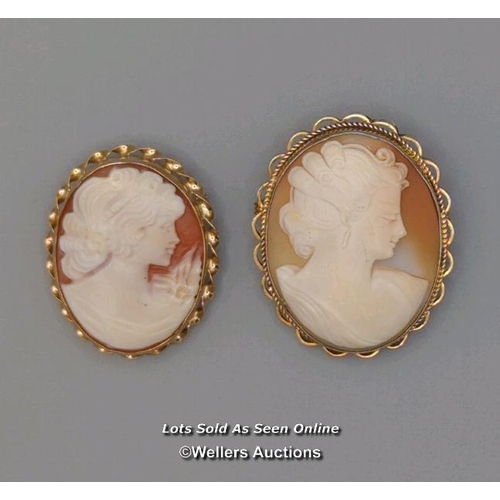 308 - Two modern oval shell cameo brooches, the first mounted in 9ct gold with twisted wire border and rol... 