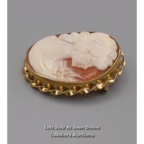 308 - Two modern oval shell cameo brooches, the first mounted in 9ct gold with twisted wire border and rol... 