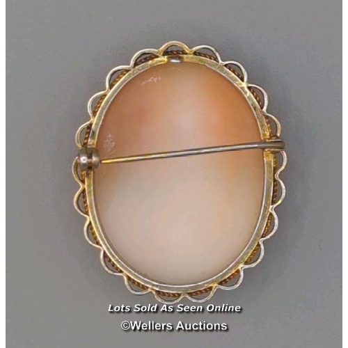 308 - Two modern oval shell cameo brooches, the first mounted in 9ct gold with twisted wire border and rol... 