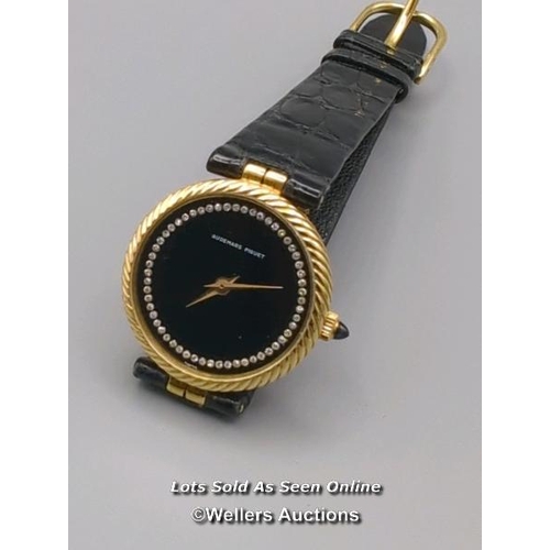 310 - Audemars Piguet. A ladies gold 1970's wristwatch, the black signed dial set with 56 round brilliant ... 