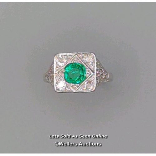 311 - Antique ring of Art Deco design, the central cushion cut emerald surrounded by old cut diamonds pave... 